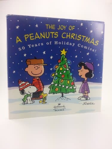 Book cover for The Joy of a Peanuts Christmas: 50 Years of Holiday Comics! by Charles M. Schulz
