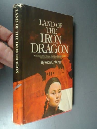 Book cover for Land of the Iron Dragon by Young, Alida E.
