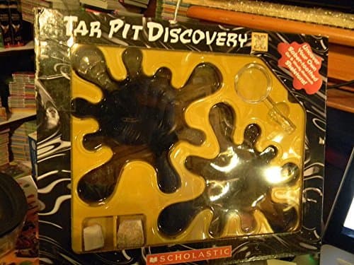 Book cover for Tar Pit Discovery Kit includes Booklet, rock samples, magnifying glass and two "tar" pits where you will find saber-toothed cat and wooly mammoth skeletons (boxed set) by none indicated