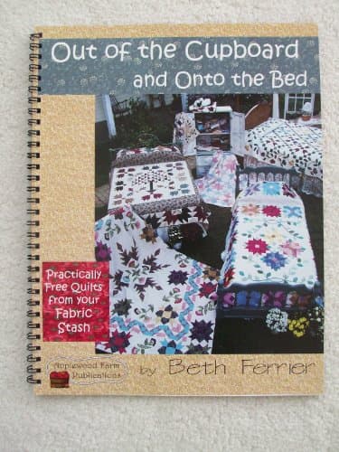 Book cover for Out of the Cupboard and Onto the Bed: Practically Free Quilts from Your Fabric Stash by Ferrier, Beth